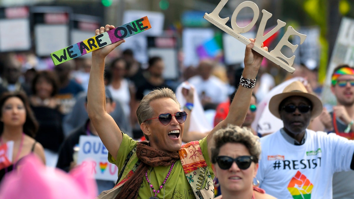 Marchers celebrate during the Los Angeles LGBTQ #ResistMarch, Sunday, June 11, 2017, in West Hollywood, Calif. (AP Photo/Mark J. Terrill)