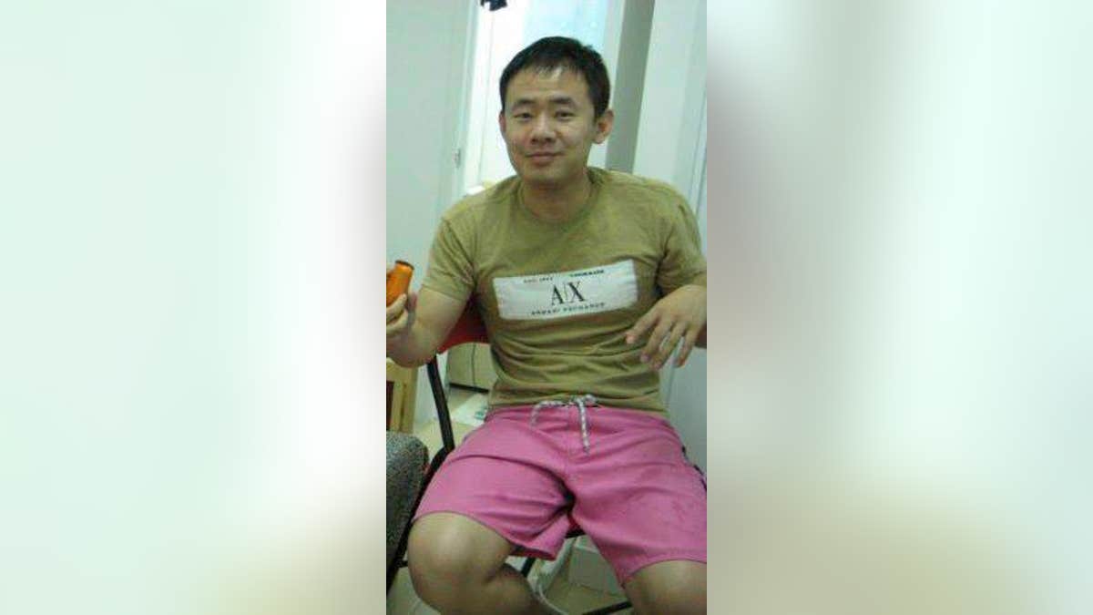 This 2009 handout photo released by a friend of Xiyue Wang, shows Xiyue Wang at his apartment in Hong Kong, China. Princeton University professor Stephen Kotkin, who advised Wang, a Chinese-American researcher sentenced to prison in Iran, defended his former student as innocent of all charges against him. Kotkin told The Associated Press by email that Xiyue Wang is a