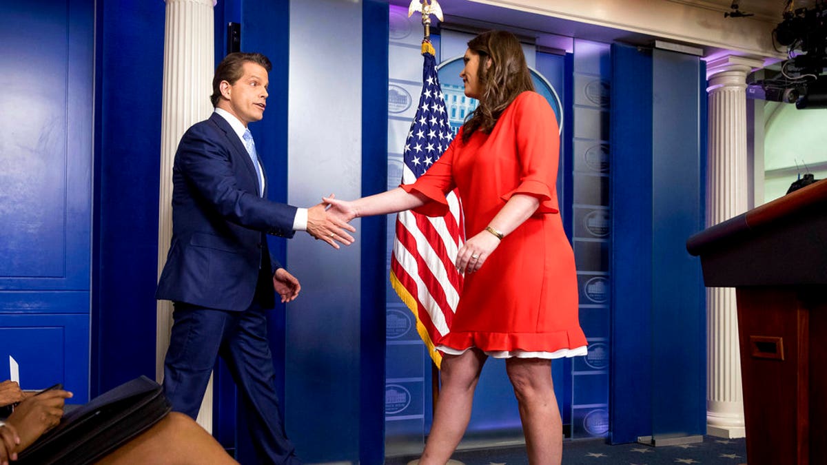 Anthony Scaramucci, incoming White House communications director, shakes hands with the White House press secretary Sarah Huckabee Sanders as he takes the podium at the daily press briefing at the White House, Friday, July 21, 2017, in Washington. White House press secretary Sean Spicer resigned earlier in the day.