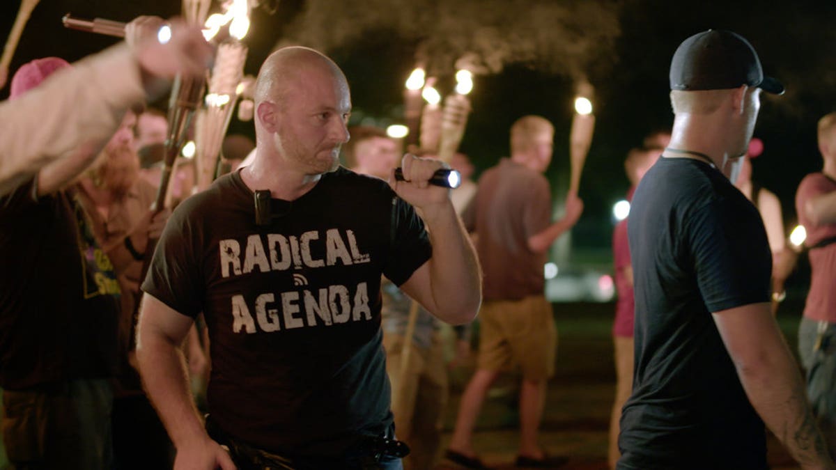 ADDS ID: In this Friday, Aug. 11, 2017, image made from a video provided by Vice News Tonight, Christopher Cantwell attends a white nationalist rally in Charlottesville, Va. For all the words flowing since last weekend in Charlottesville, the most striking television reporting has been Vice Media's insider account of the white nationalist movement and what it has wrought. Correspondent Elle Reeve's initial story of the weekend violence took up the entirety of HBO's half-hour 