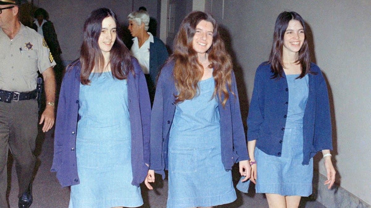 FILE - In this Aug. 20, 1970 file photo, Charles Manson followers, from left: Susan Atkins, Patricia Krenwinkel and Leslie Van Houten, walk to court to appear for their roles in the 1969 cult killings of seven people, including pregnant actress Sharon Tate, in Los Angeles, Calif. Van Houten is expected to get a court hearing Thursday, Aug. 31, 2017, to evaluate the role of her young age in the killing of a California couple four decades ago.(AP Photo/George Brich, File)