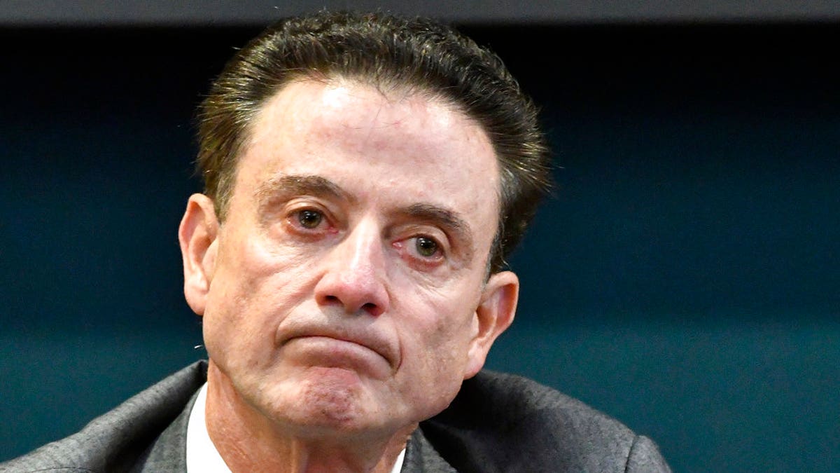 FILE - In this Oct. 20, 2016, file photo, Louisville coach Rick Pitino reacts to a question during an NCAA college basketball press conference in Louisville, Ky. Louisville announced Wednesday, Sept. 27, 2017, that they have placed basketball coach Rick Pitino and athletic director Tom Jurich on administrative leave amid an FBI probe.   (AP Photo/Timothy D. Easley, File)
