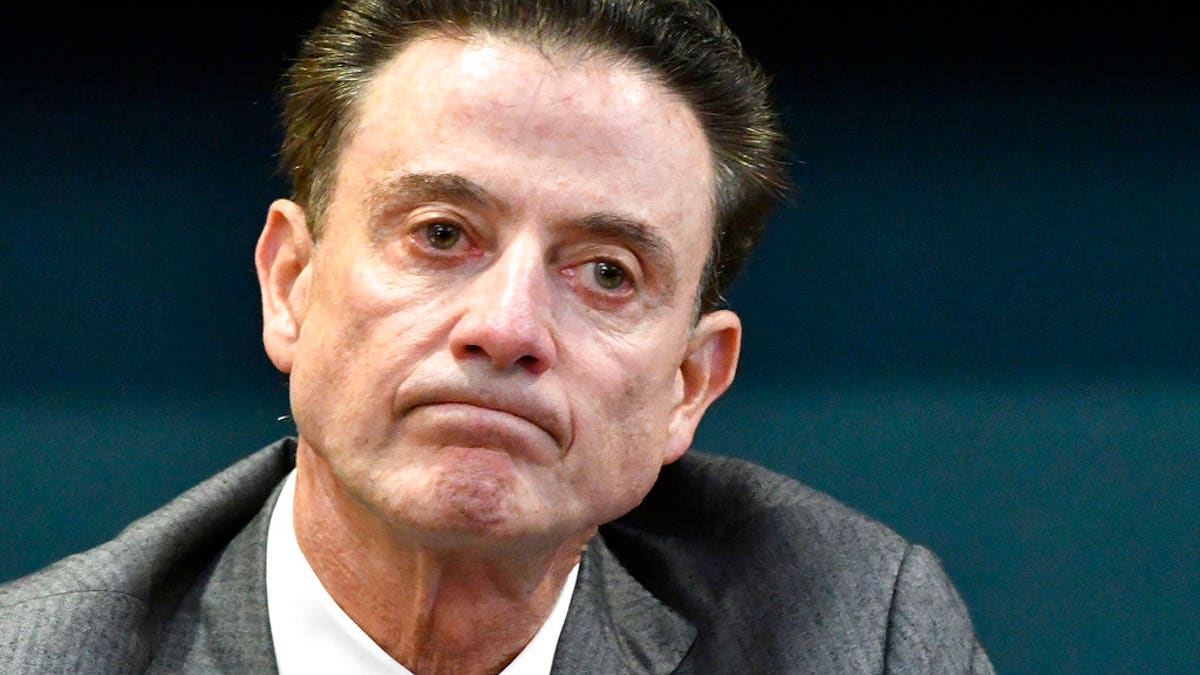 FILE - In this Oct. 20, 2016, file photo, Louisville coach Rick Pitino reacts to a question during an NCAA college basketball press conference in Louisville, Ky. Louisville announced Wednesday, Sept. 27, 2017, that they have placed basketball coach Rick Pitino and athletic director Tom Jurich on administrative leave amid an FBI probe.   (AP Photo/Timothy D. Easley, File)