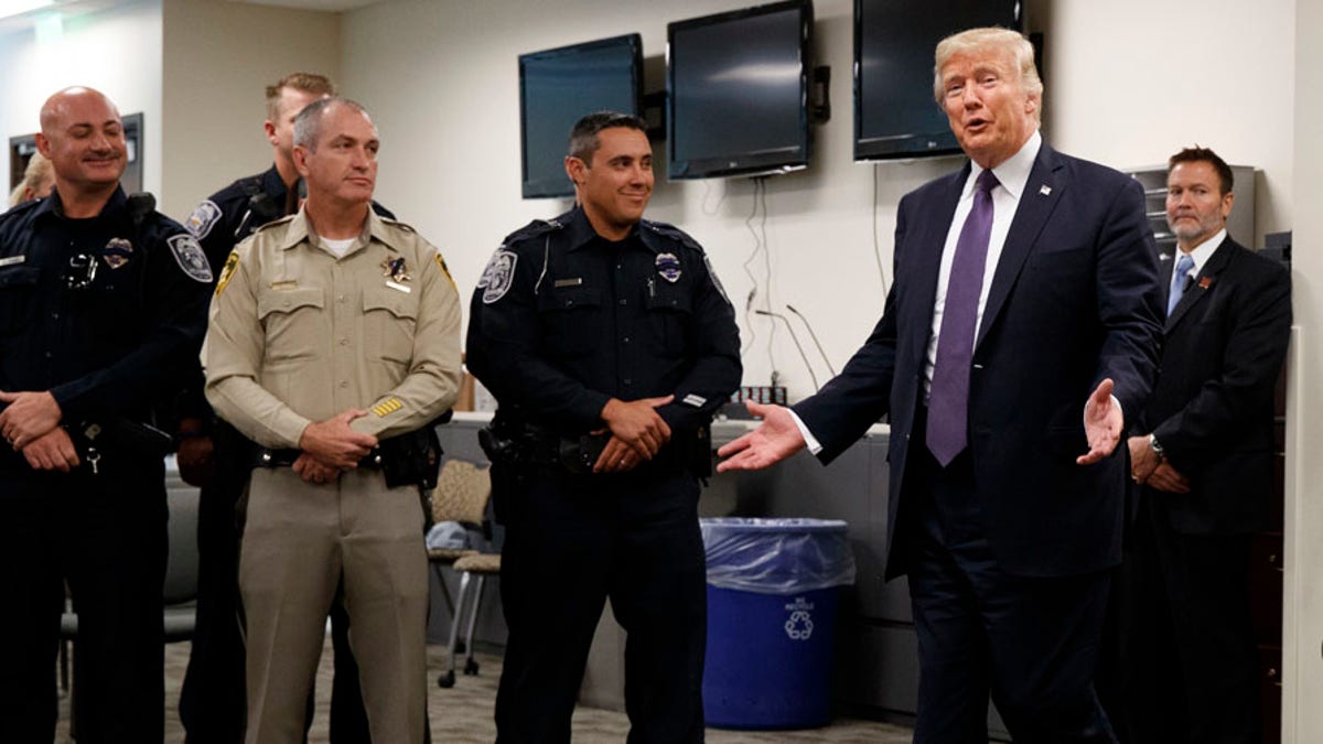 President Donald Trump arrives to meet with first responders at the Las Vegas Metropolitan Police Department, Wednesday, Oct. 4, 2017, in Las Vegas. (AP Photo/Evan Vucci)
