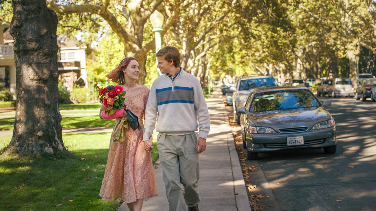This image released by A24 Films shows Saoirse Ronan, left, and Lucas Hedges in a scene from 