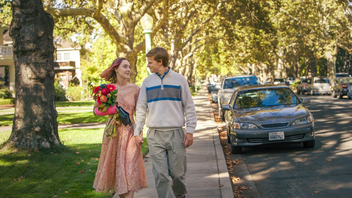 This image released by A24 Films shows Saoirse Ronan, left, and Lucas Hedges in a scene from 