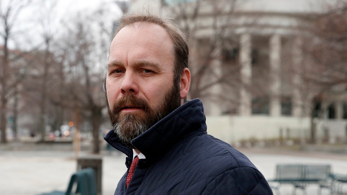 Rick Gates departs Federal District Court, Wednesday, Feb. 14, 2018, in Washington. Paul Manafort, the former campaign chairman for President Donald Trump, and his business associate Rick Gates were in federal court on Wednesday for a routine status conference. Both were indicted in October on charges stemming from foreign lobbying work in Ukraine. (AP Photo/Alex Brandon)