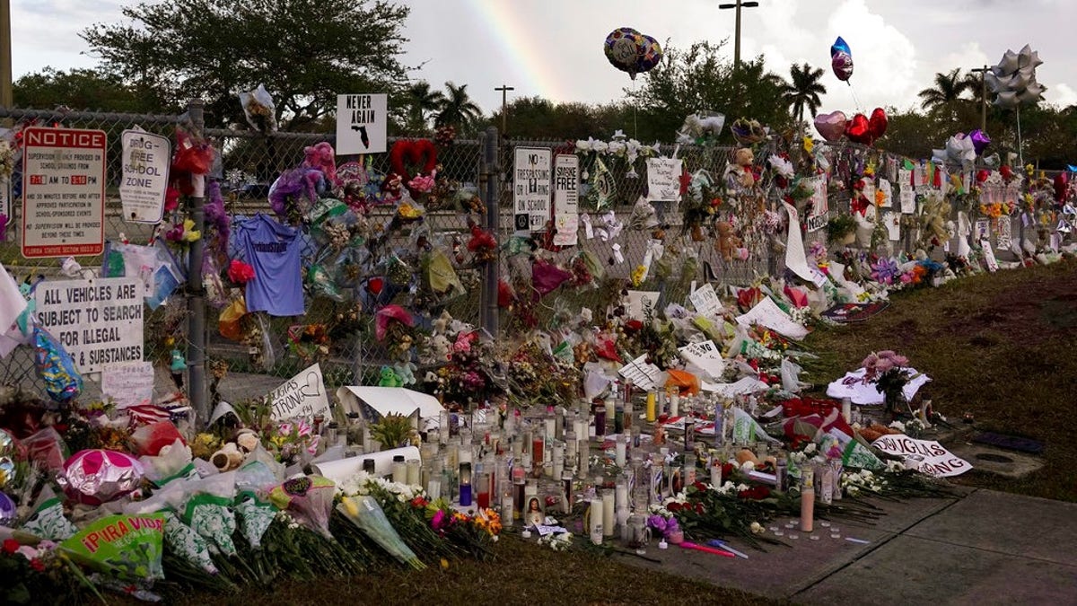 A rainbow is seen over the memorial