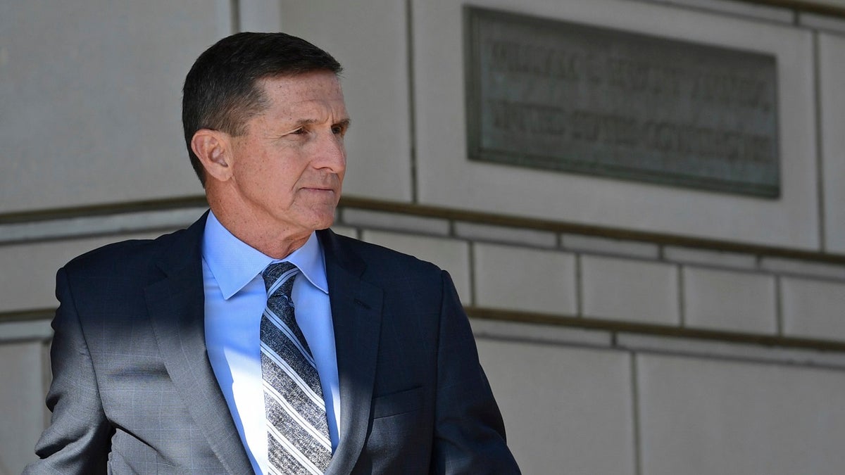 FILE - In this Dec. 1, 2017, file photo, former Trump national security adviser Michael Flynn leaves federal court in Washington. Disgraced former National Security Adviser Michael Flynn is campaigning for a Republican congressional candidate in California. He endorsed Republican Omar Navarro in his challenge of 14-term Democratic Rep. Maxine Waters at a campaign event in La Quinta, Friday, March 16, 2018. (AP Photo/Susan Walsh, File)