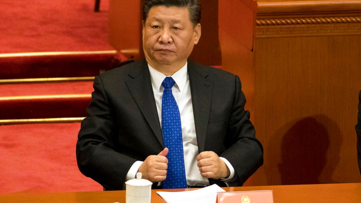 FILE - In this Saturday, March 3, 2018, file photo, Chinese President Xi Jinping attends the opening session of the Chinese People's Political Consultative Conference in Beijing's Great Hall of the People. The Chinese Communist Party's move to exert direct control over state broadcasters and regulators of everything from movies and TV to books and radio programs shows the partyâs drive to use the media for ideological efforts at home and to improve its image overseas, analysts say. (AP Photo/Ng Han Guan, File)