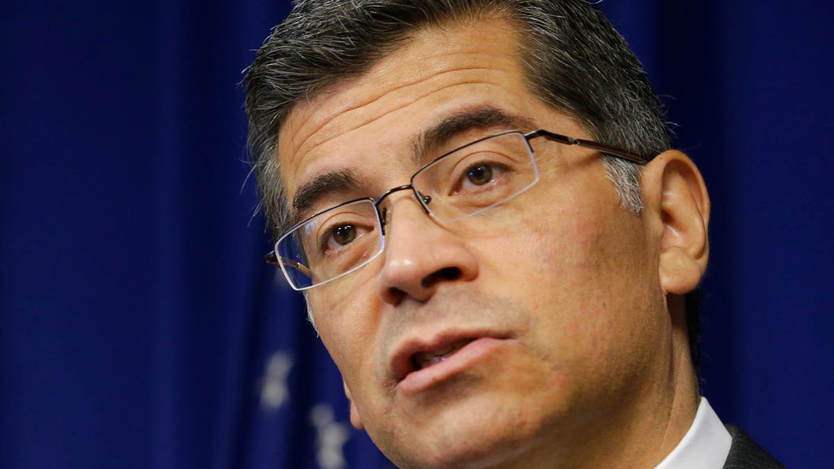 FILE - In this Jan. 18, 2018, file photo, California Attorney General Xavier Becerra speaks at a news conference in Sacramento, Calif. California is suing the Trump administration over its decision to add a question about citizenship to the 2020 U.S. Census. In announcing the lawsuit Tuesday, March 27 Becerra says adding such a question is a reckless decision that would violate the U.S. Constitution and cause a population undercount. (AP Photo/Rich Pedroncelli, File)