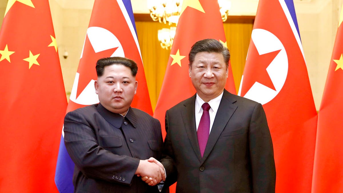 b99a0ccc-Kim Jong Un Xi Jinping