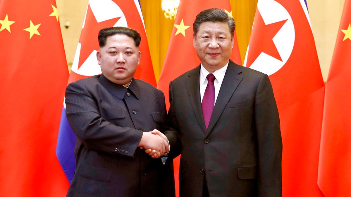 b99a0ccc-Kim Jong Un Xi Jinping