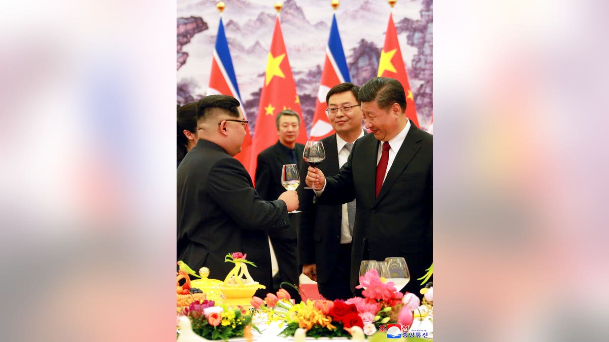 Xi Jinping and Kim Jong Un