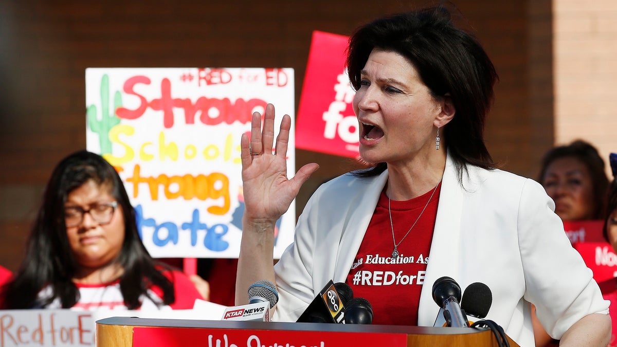 NEA President Lily Eskelsen Garcia speaks at the #RedForEd Walkout, March and Rally news conference regarding teacher pay and school funding Wednesday, April 25, 2018, in Phoenix. Arizona teachers are scheduled to go on strike Thursday. (AP Photo/Ross D. Franklin)
