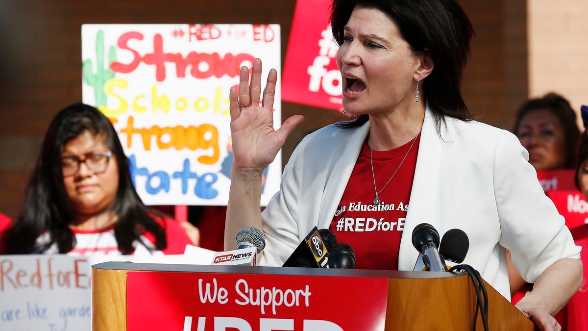 NEA President Lily Eskelsen Garcia speaks at the #RedForEd Walkout, March and Rally news conference regarding teacher pay and school funding Wednesday, April 25, 2018, in Phoenix. Arizona teachers are scheduled to go on strike Thursday. (AP Photo/Ross D. Franklin)