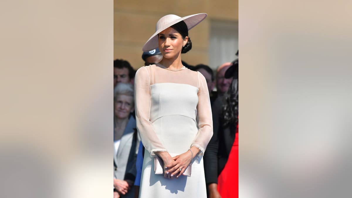 Meghan, the Duchess of Sussex attends a garden party at Buckingham Palace in London, Tuesday May 22, 2018, her first royal engagement since her wedding to Prince Harry on Saturday. The event is part of the celebrations to mark the 70th birthday of Prince Charles. (Dominic Lipinski/Pool Photo via AP)