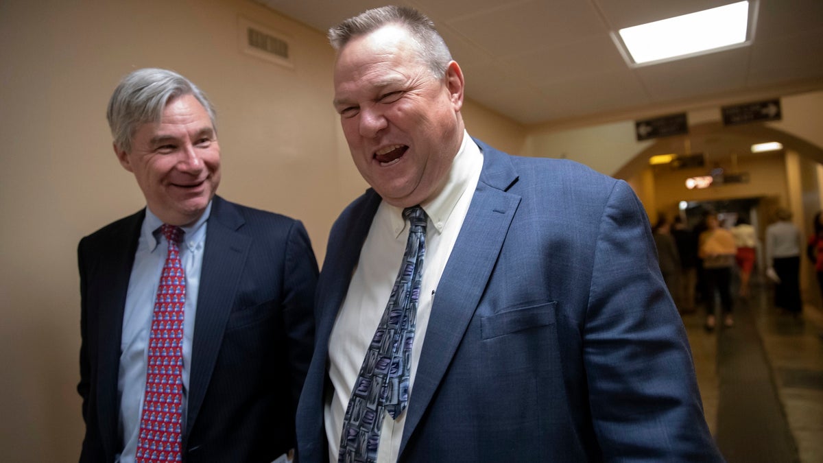 Sen. Sheldon Whitehouse, D-R.I., left, and Sen. Jon Tester, D-Mont., leave the Capitol following votes as the Congress prepares to depart Washington for the Memorial Day break, Thursday, May 24, 2018. (AP Photo/J. Scott Applewhite)