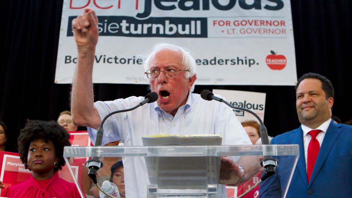 Sen. Bernie Sanders, I-Vt., accompanied by Democrat Ben Jealous, right, speaks to the crowd during a gubernatorial campaign rally in Maryland's Democratic primary in downtown Silver Spring, Md., Monday, June 18, 2018. (AP Photo/Jose Luis Magana)