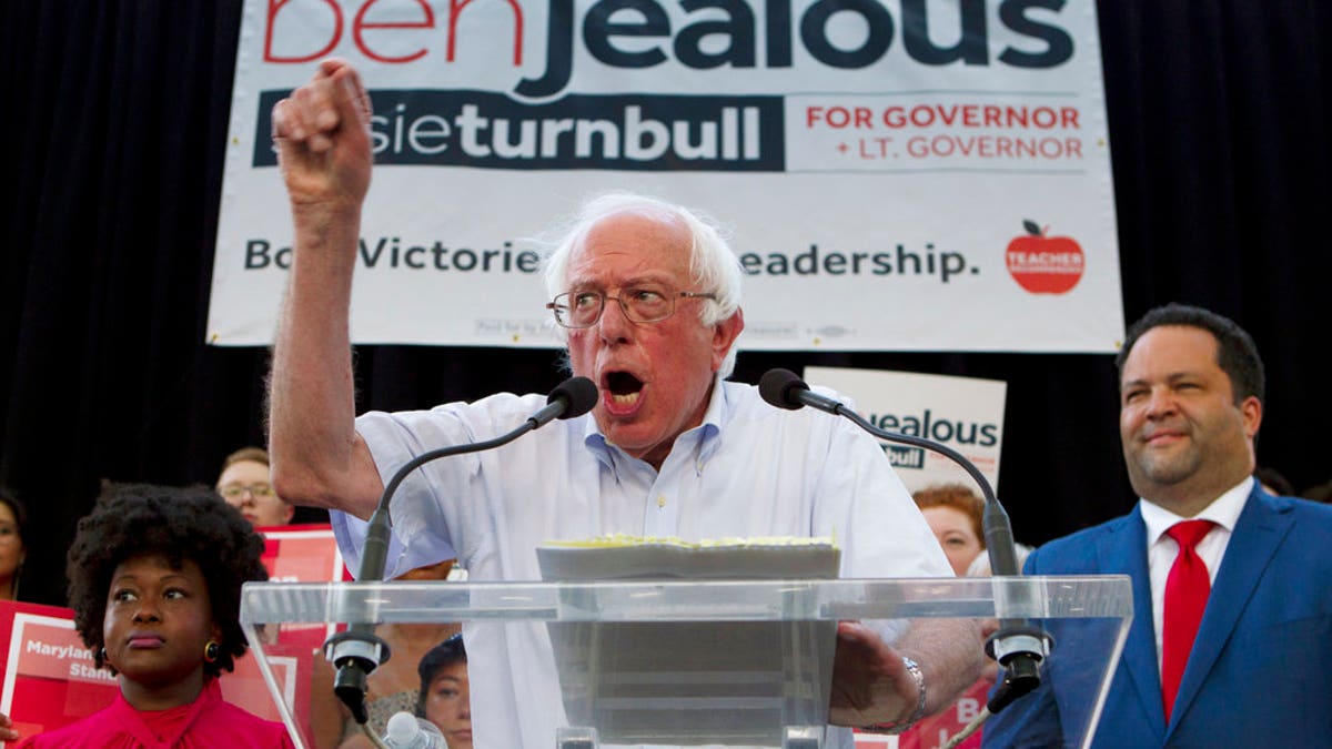 Sen. Bernie Sanders, I-Vt., accompanied by Democrat Ben Jealous, right, speaks to the crowd during a gubernatorial campaign rally in Maryland's Democratic primary in downtown Silver Spring, Md., Monday, June 18, 2018. (AP Photo/Jose Luis Magana)