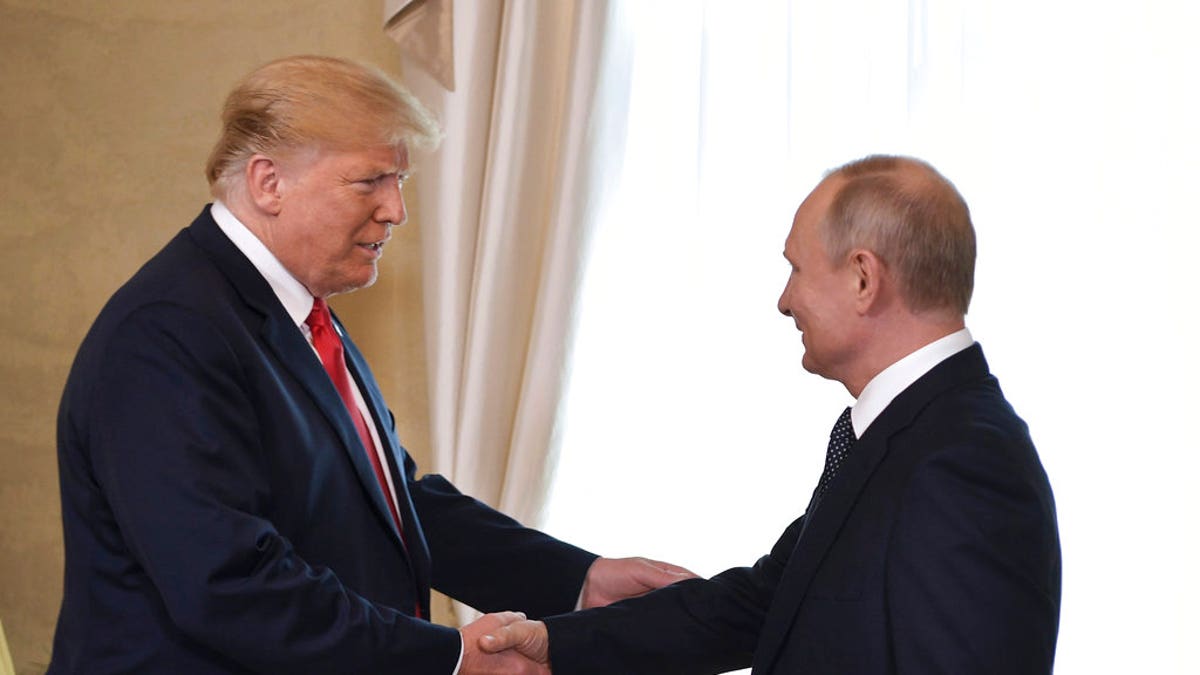 Trump shakes Putin's hand