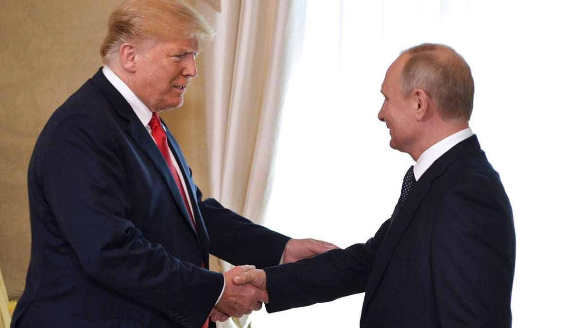 Trump shakes Putin's hand