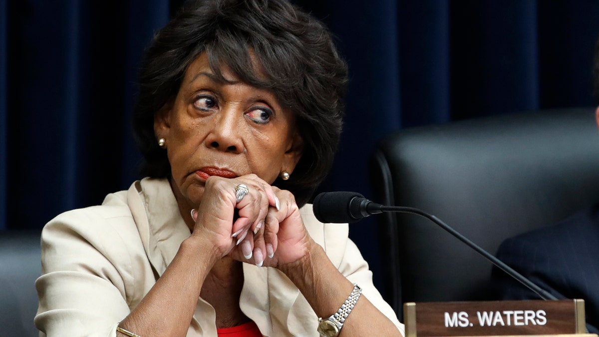 House Committee on Financial Services Ranking Member Rep. Maxine Waters, D-Calif., left, listens next to Chair Rep. Jeb Hensarling, R-Texas, during a hearing with Federal Reserve Board Chair Jerome Powell, Wednesday, July 18, 2018, on Capitol Hill in Washington. (AP Photo/Jacquelyn Martin)
