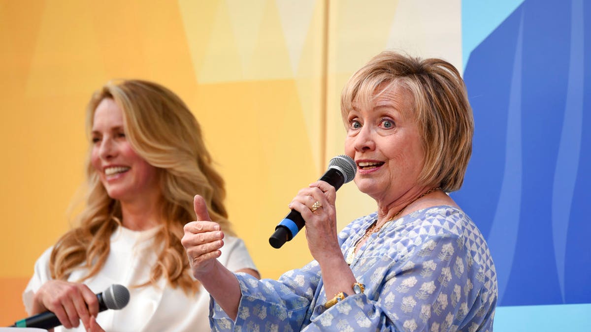 Democratic presidential candidate and former Secretary of State Hillary Rodham Clinton, right, in conversation with Laurene Powell Jobs at OZY Fest in Central Park on Saturday, July 21, 2018, in New York. (Photo by Evan Agostini/Invision/AP)