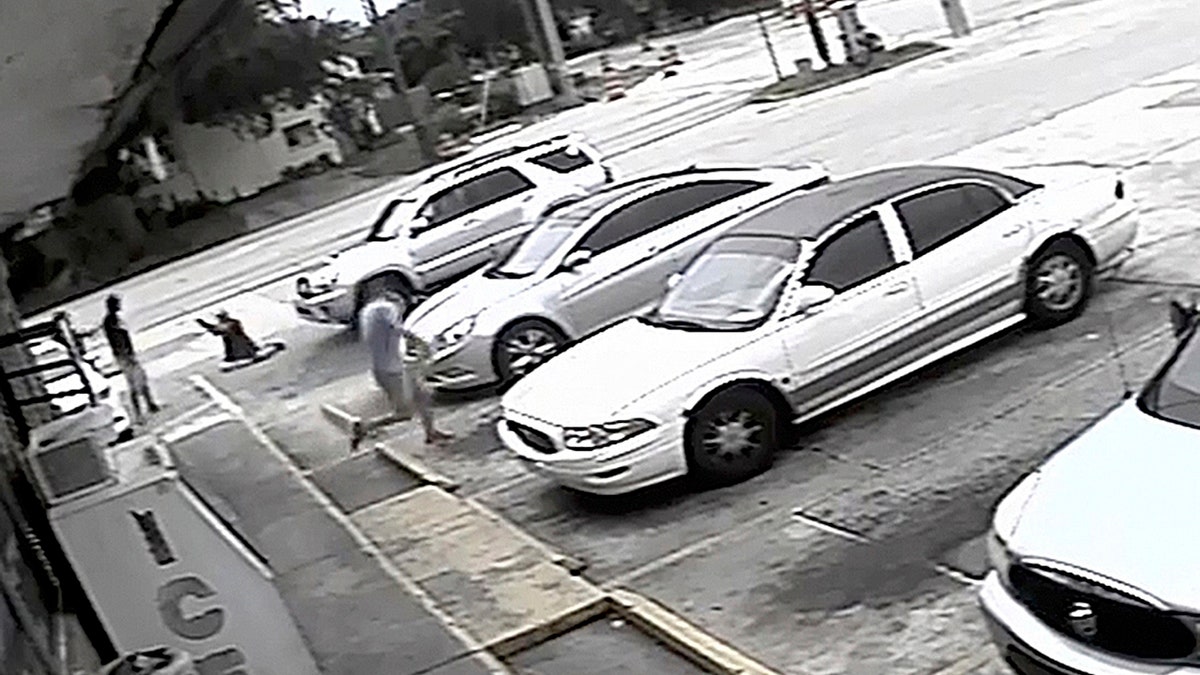 FILE - In this July 19, 2018 file frame from surveillance video released by the Pinellas County Sheriff's Office, Markeis McGlockton, far left, is shot by Michael Drejka during an altercation in the parking lot of a convenience store in Clearwater, Fla.  Prosecutors charged a white man, Michael Drejka, with manslaughter Monday Aug. 13, 2018  in the death of an unarmed black man whose videotaped shooting in a store parking lot has revived debate over Floridaâs âstand your groundâ law. (Pinellas County Sheriff's Office via AP, File)