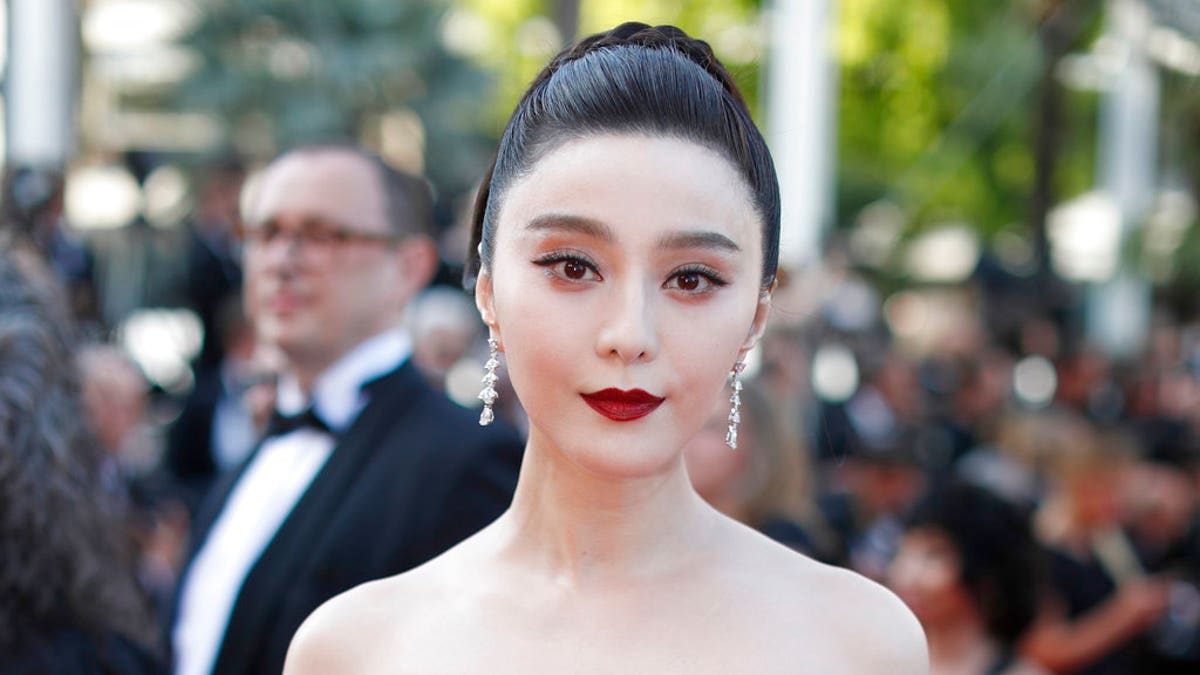 FILE - In this May 24, 2017, file photo, Fan Bingbing poses for photographers as she arrives for the screening of the film The Beguiled at the 70th international film festival, Cannes, southern France. Chinese actress Fan has disappeared from social media amid rumors she is the target of a tax evasion investigation and that she, her brother and boyfriend have been barred from leaving China. (AP Photo/Thibault Camus, File)