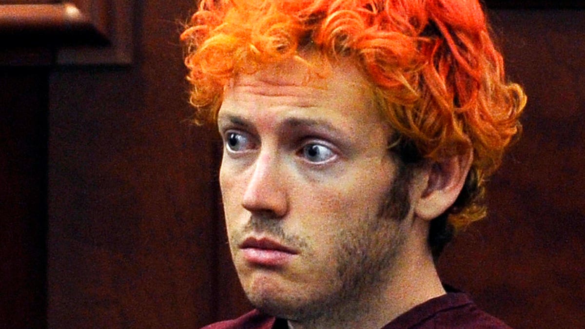 FILE - In this July 23, 2012, file photo, James Holmes, who was convicted of killing 12 moviegoers and wounding 70 more in a shooting spree in a crowded theatre in 2012, sits in Arapahoe County District Court in Centennial, Colo. In a new book and an interview with The Associated Press, psychiatrist William H. Reid, who spent hours talking with Holmes, says what led Holmes to open fire was a vortex of his mental illness, his personality and his circumstances, along with other, unknown factors. (RJ Sangosti/The Denver Post via AP, Pool, File)