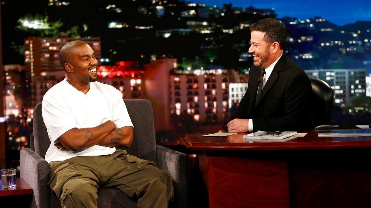 In this image released by ABC, musician Kanye west, left, and host Jimmy Kimmel appear on the set of  