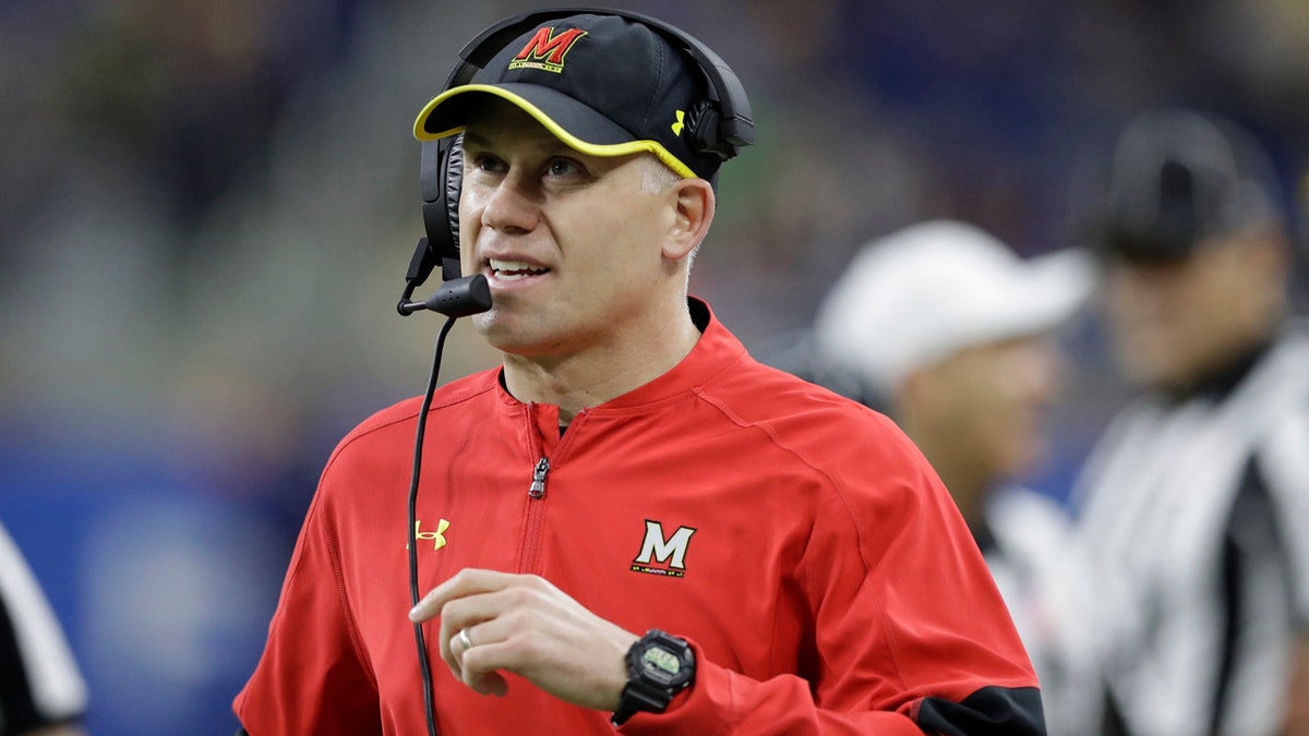 FILE - In this Dec. 26, 2016, file photo, Maryland head coach DJ Durkin walks the sideline during the first half of the Quick Lane Bowl NCAA college football game against Boston College in Detroit. Maryland placed the head of the football team's strength and conditioning staff on paid leave while it investigates claims he verbally abused and humiliated players, a person briefed on the situation said. The person spoke to The Associated Press on Saturday, Aug. 11, 2018, on condition of anonymity because Maryland had not announced the decision regarding Rick Court. The person says athletic director Damon Evans spoke with the football team Saturday morning and Durkin was still leading the program.  (AP Photo/Carlos Osorio, File)