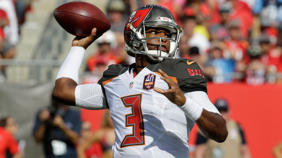 FILE - In this Sept. 13, 2015, file photo, Tampa Bay Buccaneers quarterback Jameis Winston (3) looks to throw the ball during the first half of an NFL football game against the Tennessee Titans in Tampa, Fla. Winston was the top pick in the draft that year and had a solid summer to win the starting job. He got off to a bad start in front of the home crowd, though, as his first pass was intercepted and returned for a touchdown by Coty Sensabaugh. (AP Photo/Chris O'Meara, File)