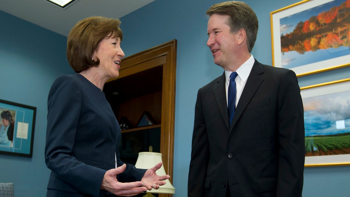 FILE- In this Tuesday, Aug. 21, 2018, file photo, Sen. Susan Collins, R-Maine, speaks with Supreme Court nominee Judge Brett Kavanaugh at her office, before a private meeting on Capitol Hill in Washington. The end of contentious confirmation hearings for U.S. Supreme Court nominee Kavanaugh is shifting the focus to potential swing votes like Republican Sen. Susan Collins of Maine. (AP Photo/Jose Luis Magana, files)