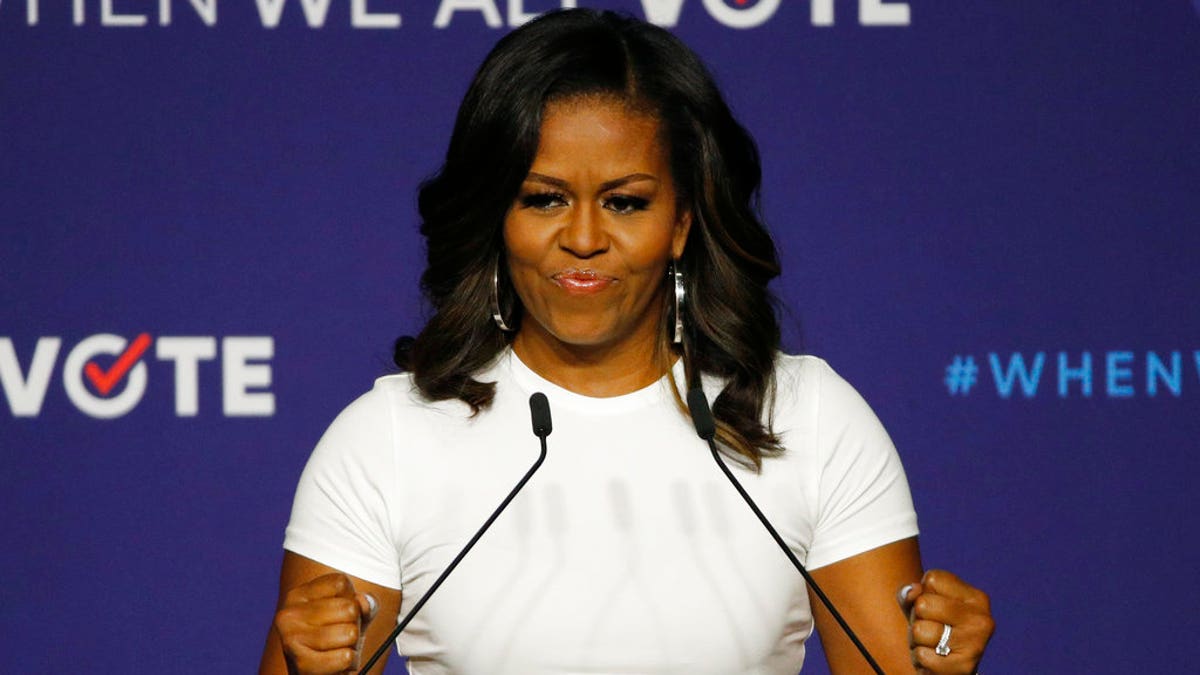 Former first lady Michelle Obama speaks at a rally to encourage voter registration, Sunday, Sept. 23, 2018, in Las Vegas. (AP Photo/John Locher)
