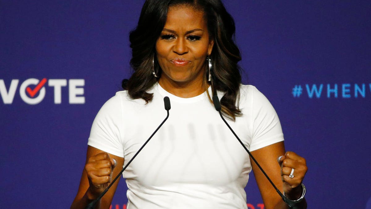 Former first lady Michelle Obama speaks at a rally to encourage voter registration, Sunday, Sept. 23, 2018, in Las Vegas. (AP Photo/John Locher)