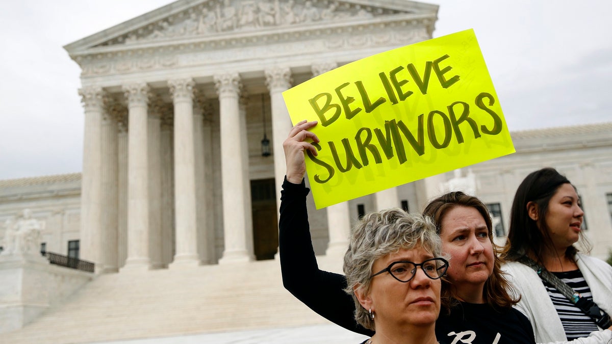 Protesters gather in front of the Supreme Court on Capitol Hill in Washington, Thursday, Sept. 27, 2018. The Senate Judiciary Committee is scheduled to hear from Supreme Court nominee Brett Kavanaugh and Christine Blasey Ford, the woman who says he sexually assaulted her. (AP Photo/Patrick Semansky)