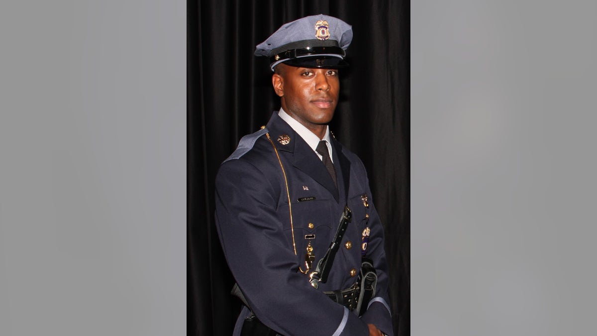 This undated photo provided by the Prince George's County Police Department shows officer Jacai Colson, a 4-year veteran of the Maryland county's police force. A gunman fired outside a Maryland police station on Sunday, March 13, 2016, prompting a gun battle that killed Colson and wounded the suspect, authorities said. (Prince George's County Police Department via AP)