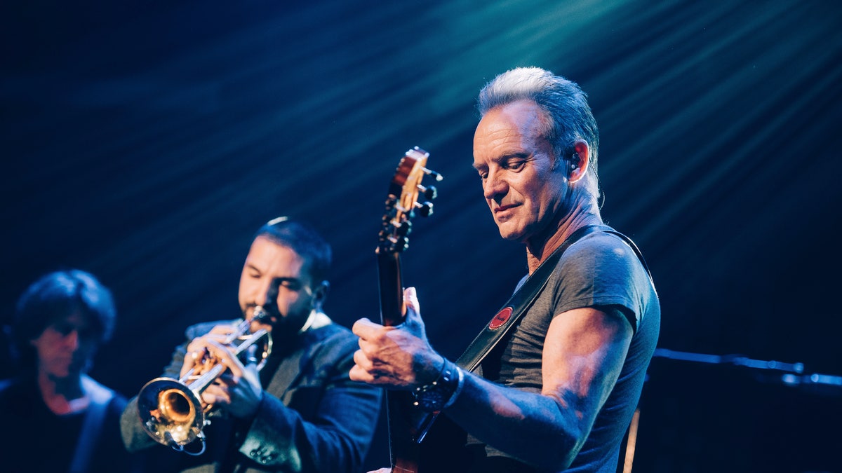 In this Saturday, Nov. 12, 2016 photo provided by Universal Music France, British musician Sting performs on stage at the Bataclan concert hall in Paris, France, Saturday, Nov. 12, 2016. A concert by British pop legend Sting is marking the reopening of the Paris' Bataclan concert hall one year after suicidal jihadis turned it into a bloodbath and killed 90 revelers. (Boris Allin/Universal Music France via AP) MANDATORY CREDIT