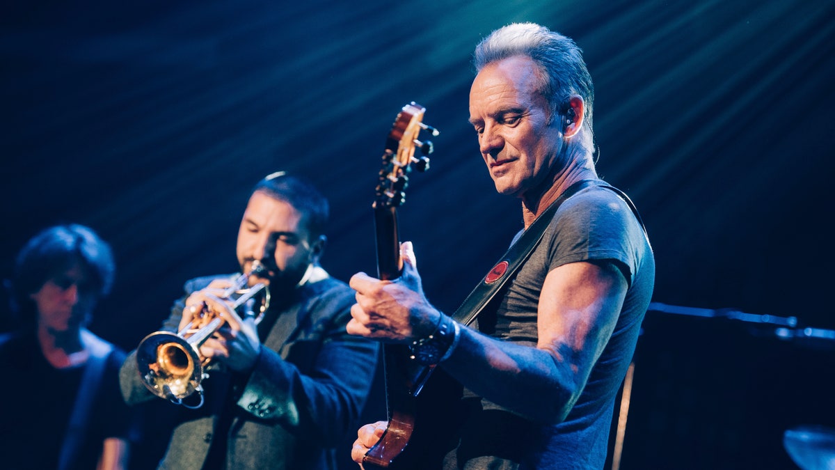 In this Saturday, Nov. 12, 2016 photo provided by Universal Music France, British musician Sting performs on stage at the Bataclan concert hall in Paris, France, Saturday, Nov. 12, 2016. A concert by British pop legend Sting is marking the reopening of the Paris' Bataclan concert hall one year after suicidal jihadis turned it into a bloodbath and killed 90 revelers. (Boris Allin/Universal Music France via AP) MANDATORY CREDIT