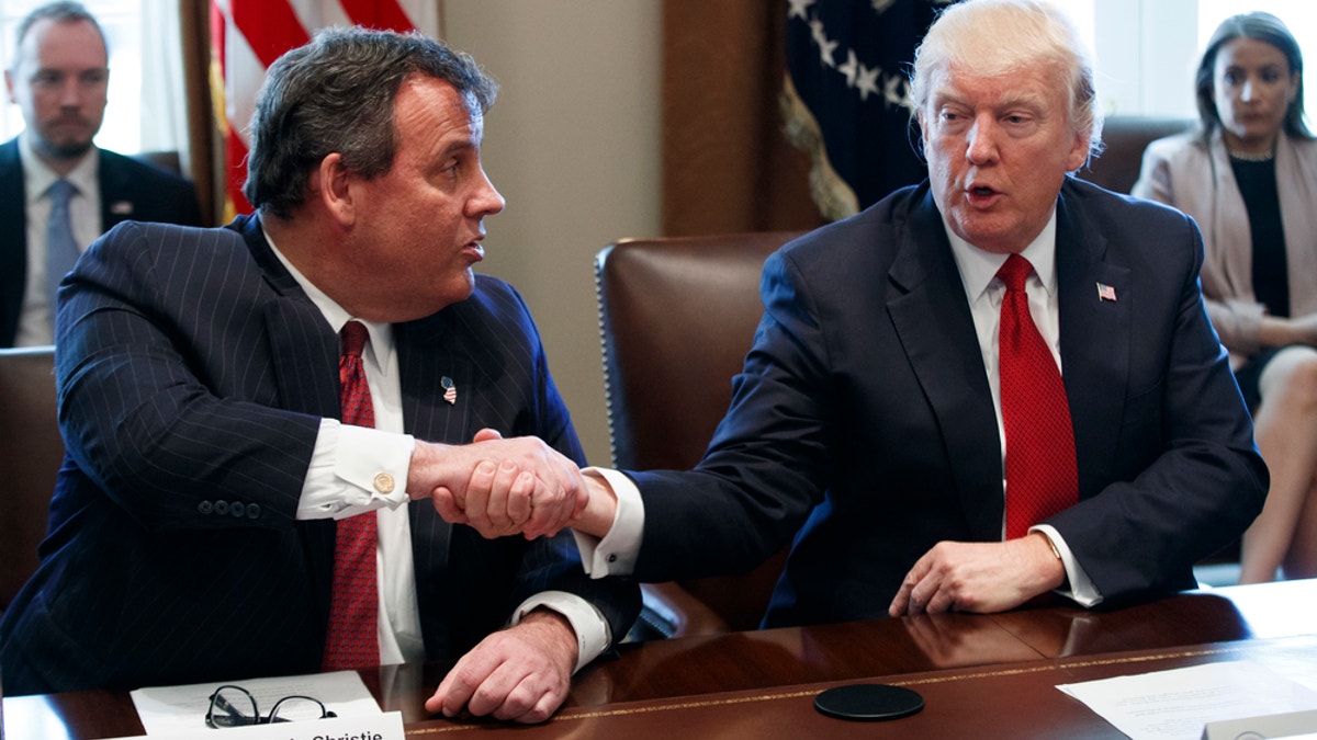 President Donald Trump shakes hands with New Jersey Gov. Chris Christie during an opioid and drug abuse listening sessionWednesday, March 29, 2017, in the Cabinet Room of the White House in Washington. (AP Photo/Evan Vucci)