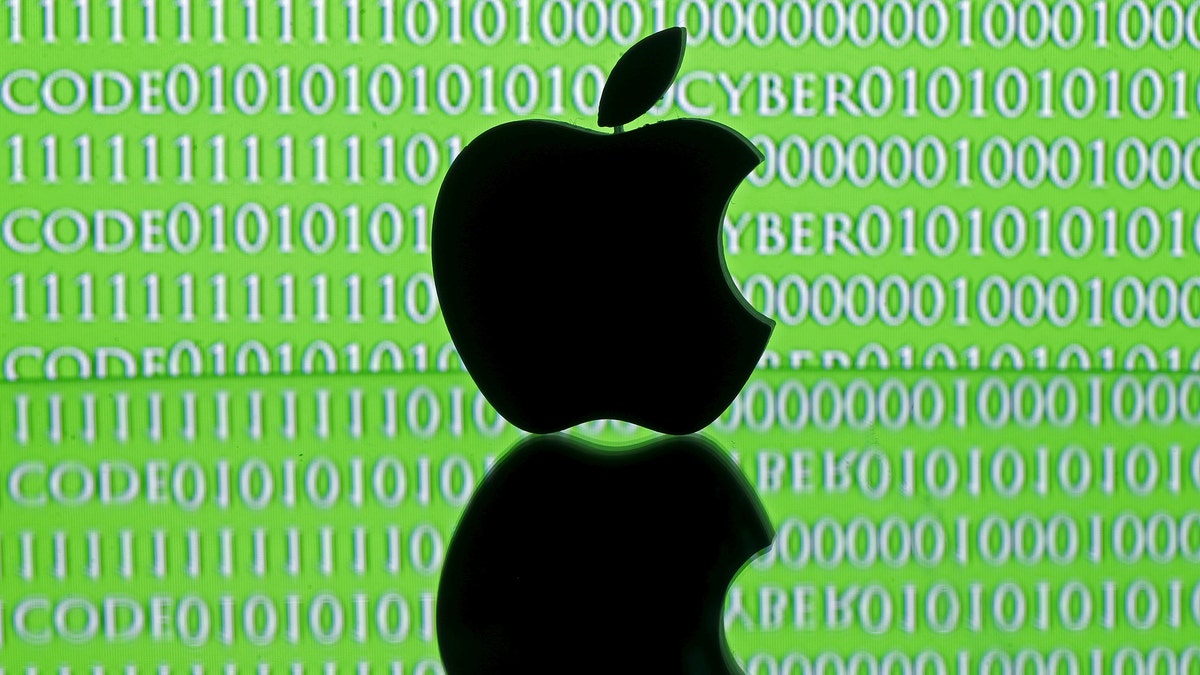 A 3D printed Apple logo is seen in front of a displayed cyber code in this illustration taken February 26, 2016. Apple Inc's stance on privacy in the face of a U.S. government demand to unlock an iPhone belonging to one of the San Bernardino attackers has raised awkward questions for the world's mobile network operators. Top executives at this week's global telecom industry gathering in Barcelona admit they are constantly trying to strike a balance between the expectations and demands of their own users, government regulators and national politicians. REUTERS/Dado Ruvic/Illustration - RTX28R0L