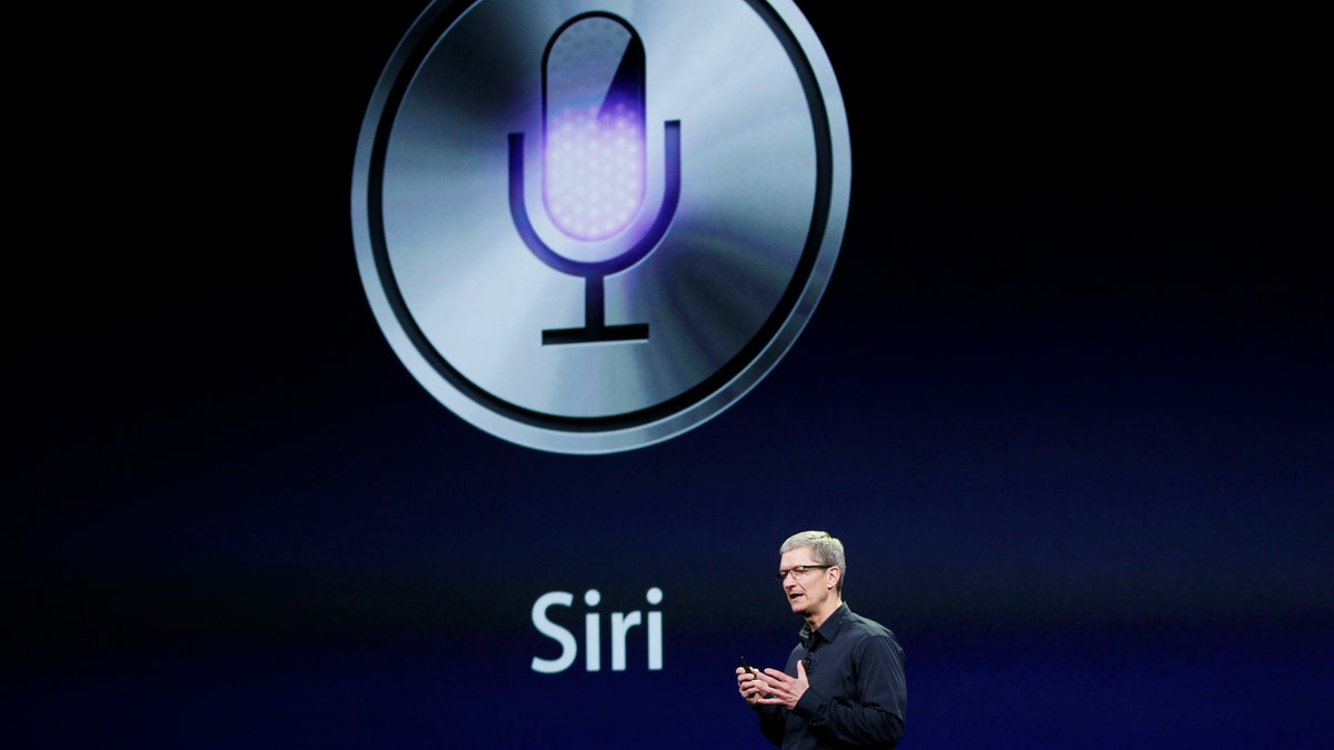 CEO Tim Cook talks about Siri during an Apple event in San Francisco, California March 7, 2012.  REUTERS/Robert Galbraith  (UNITED STATES - Tags: SCIENCE TECHNOLOGY) - RTR2YZMO