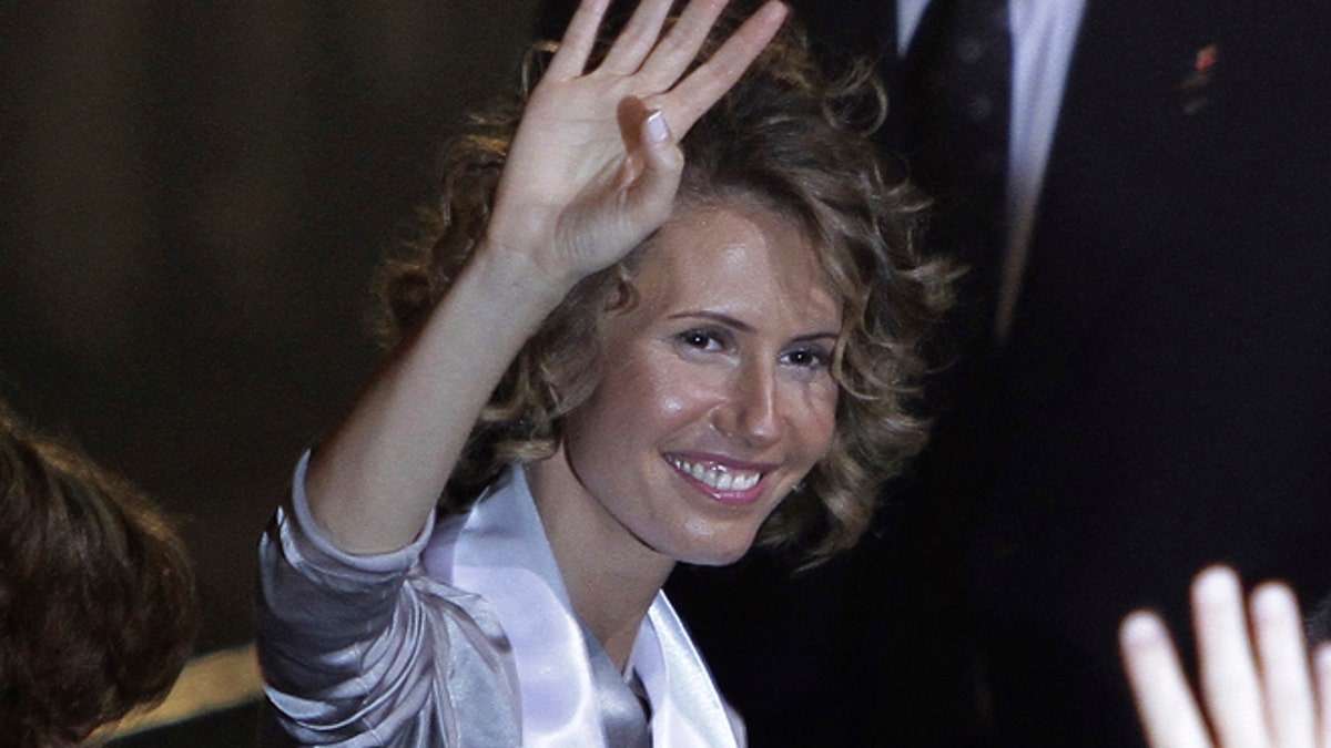 Sept. 25, 2010: Syria's First Lady Asma al-Assad waves as she attends the opening ceremony for the 7th Special Olympics Middle East/North Africa (SOMENA) Regional Games in Damascus.
