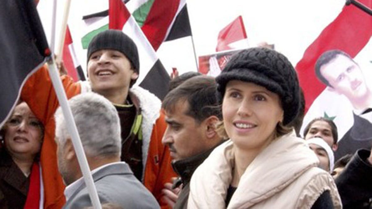 Jan. 11, 2012: Asma, the wife of Syrian President Bashar al-Assad, makes an appearance during a rally in support of her husband in Damascus.