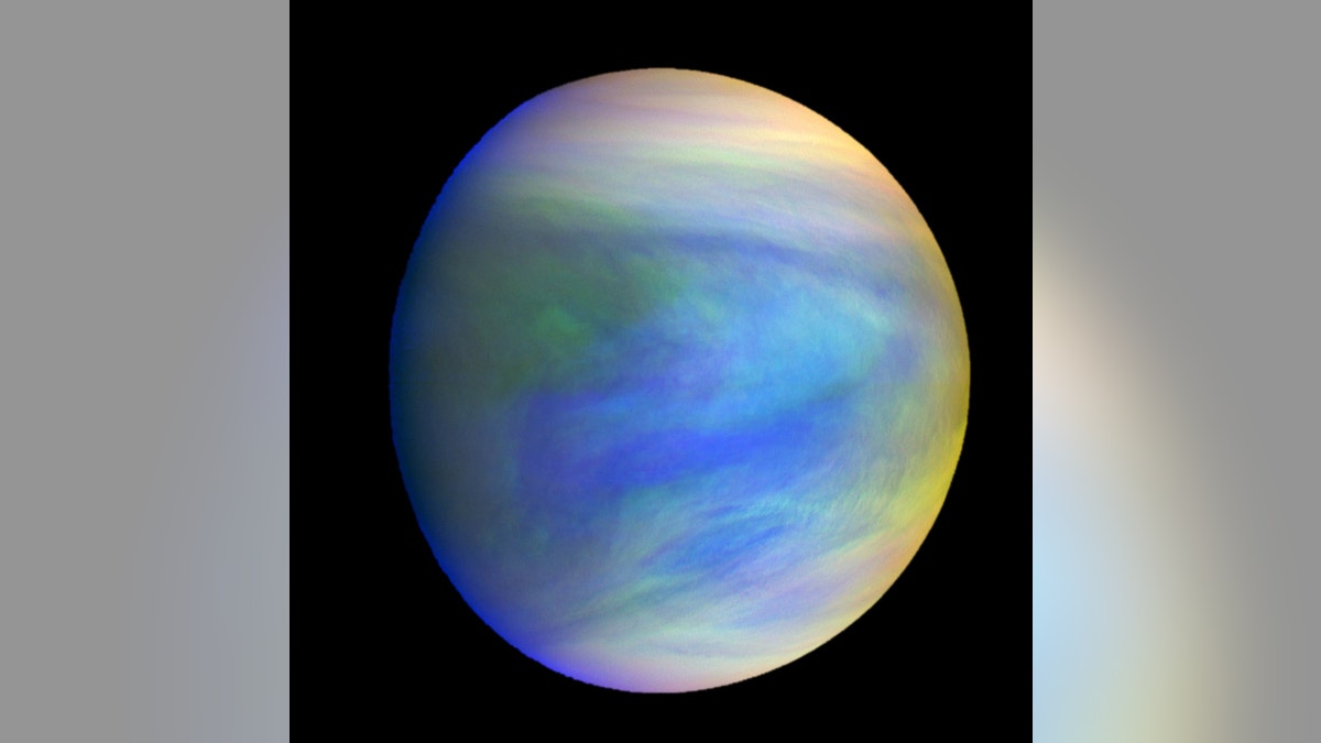 A composite image of Venus as seen by Japan's Akatsuki spacecraft. Venus' spin varies because of atmospheric waves over the planet's mountains, according to a new study.