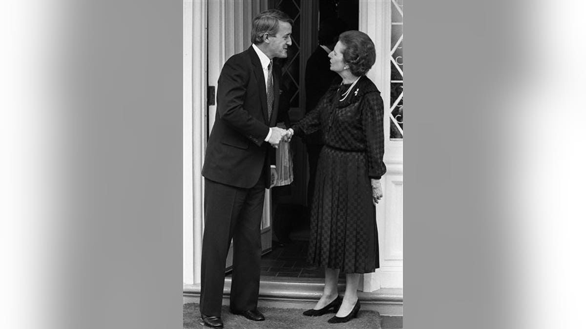 Then opposition leader Brian Mulroney shakes hands with British Prime Minister Margaret Thatcher at the British High Commissioners residence in Ottawa, Ont. Sept. 26, 1983. Thatchers former spokesman, Tim Bell, said that the former British Prime Minister Margaret Thatcher had died Monday morning, April 8, 2013, of a stroke.  She was 87 years old. (AP Photo/The Canadian Press, Ron Poling)