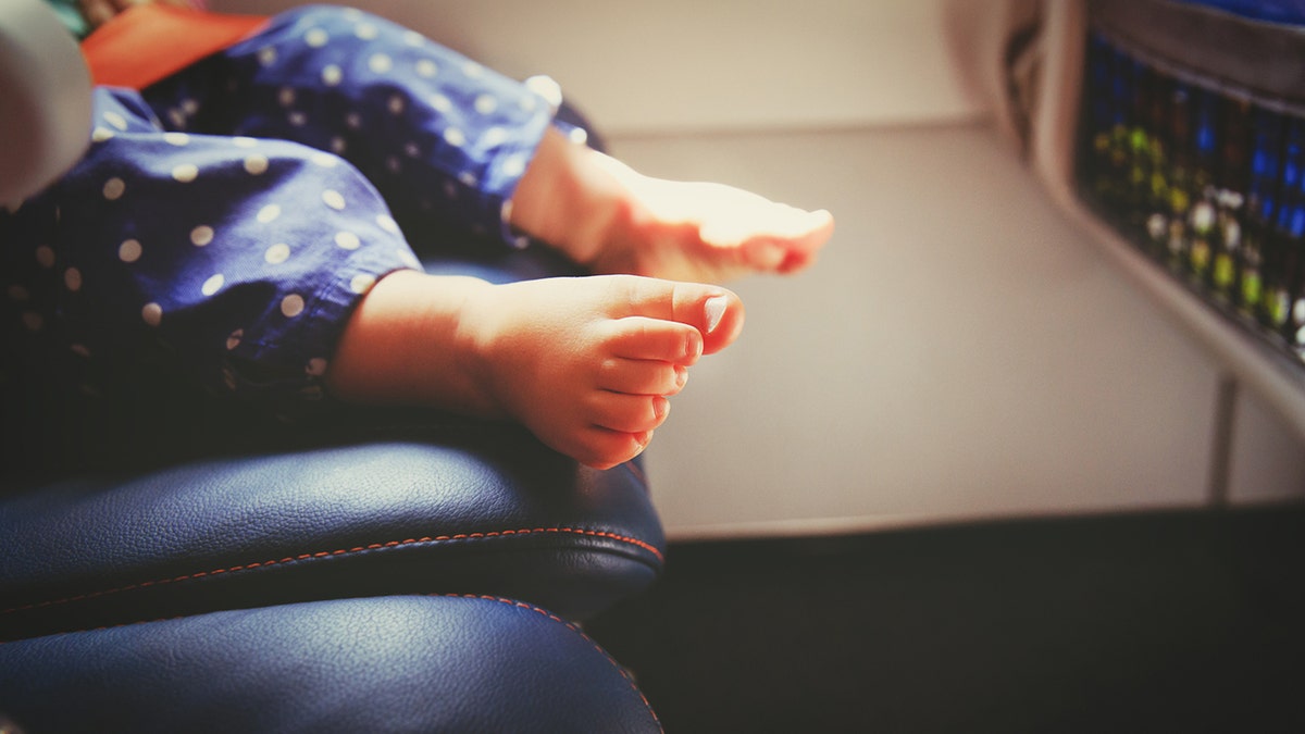 baby feet flight istock