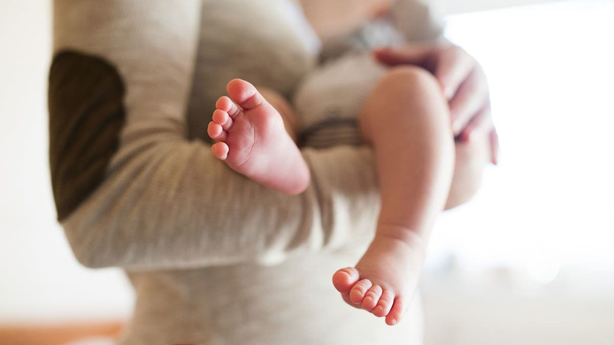 mom baby feet istock